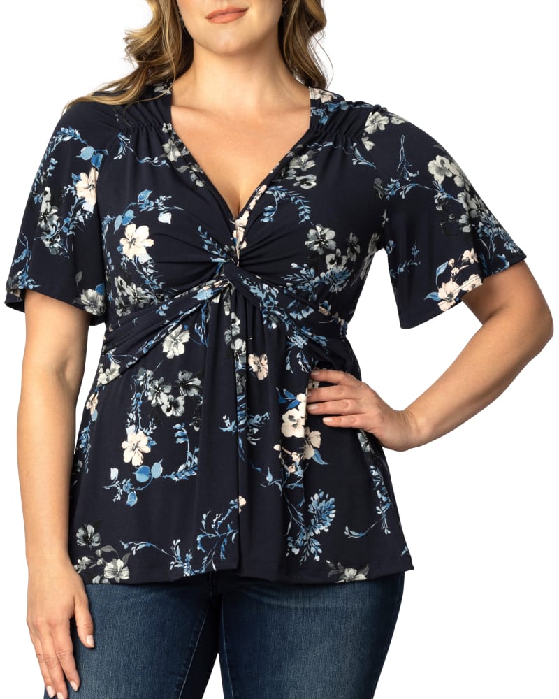 Front of a model wearing a size 5X Abby Twist Front Top in FRENCH BLUE GARDEN by Kiyonna. | dia_product_style_image_id:353017